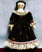Cloth and embroidered mini doll